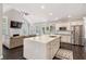 Open kitchen with island seating, stainless appliances, flows into living area with fireplace at 5041 Corinault Nw Pl, Acworth, GA 30101