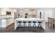 Well-equipped kitchen with oversized island, seating, stainless steel appliances, and white cabinetry at 5041 Corinault Nw Pl, Acworth, GA 30101