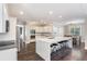 Spacious kitchen boasts a large center island with seating, stainless appliances, and adjacent dining area at 5041 Corinault Nw Pl, Acworth, GA 30101