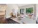 Inviting living room with large windows, hardwood floors, and stylish decor at 5041 Corinault Nw Pl, Acworth, GA 30101