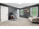 Comfortable office with plush carpeting, lots of light, and gray accent walls at 5041 Corinault Nw Pl, Acworth, GA 30101