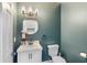 Chic powder room with decorative mirror, modern fixtures, and elegant design at 5041 Corinault Nw Pl, Acworth, GA 30101