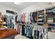 Spacious walk-in closet with shelving and clothing racks for ample storage at 5041 Corinault Nw Pl, Acworth, GA 30101