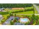Aerial view of community pool, park and horse park, all located in a beautifully landscaped neighborhood at 6390 Yellow Birch St, Cumming, GA 30040