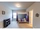 Well-lit bedroom with queen-sized bed and black storage shelves at 6390 Yellow Birch St, Cumming, GA 30040