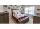 Bedroom showcasing tufted headboard bed and side tables at 6390 Yellow Birch St, Cumming, GA 30040