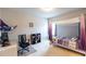 Bedroom with bed, desk, chair, and built-in shelving at 6390 Yellow Birch St, Cumming, GA 30040