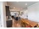 This dining room opens to the kitchen and has hardwood floors at 6390 Yellow Birch St, Cumming, GA 30040