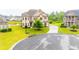 Lovely home exterior in manicured cul-de-sac with a well-kept yard and an inviting driveway at 6390 Yellow Birch St, Cumming, GA 30040