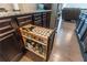 This kitchen features custom pullout spice racks and granite countertops at 6390 Yellow Birch St, Cumming, GA 30040