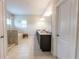 Bright and spacious main bathroom with granite countertops, a separate shower and soaking tub, and modern fixtures at 6390 Yellow Birch St, Cumming, GA 30040