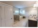 Bright primary bathroom with a granite double vanity, separate glass shower, and luxurious soaking tub at 6390 Yellow Birch St, Cumming, GA 30040
