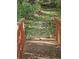 Bridge with stairs leading down to lush backyard at 1270 Heritage Lakes Dr, Mableton, GA 30126
