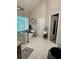 Spacious bathroom with a standalone tub, glass shower, and large window at 1270 Heritage Lakes Dr, Mableton, GA 30126