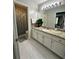 Bathroom featuring a granite countertop, ample cabinet space, and a decorative plant at 1270 Heritage Lakes Dr, Mableton, GA 30126