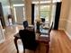 Elegant dining room with hardwood floors, a large window, and a set table for a meal at 1270 Heritage Lakes Dr, Mableton, GA 30126