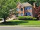 Charming two-story brick home with a well-manicured lawn and lovely blue shutters at 1270 Heritage Lakes Dr, Mableton, GA 30126