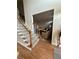 Inviting foyer with hardwood flooring, staircase, and a view into the living room at 1270 Heritage Lakes Dr, Mableton, GA 30126