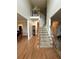 Grand foyer with hardwood floors and a staircase leading to the second floor overlook at 1270 Heritage Lakes Dr, Mableton, GA 30126