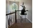 Second-floor overlook with a view of the foyer, featuring a chandelier and a decorative table at 1270 Heritage Lakes Dr, Mableton, GA 30126