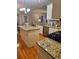 Well-equipped kitchen with stainless steel appliances, granite countertops, island, and hardwood floors at 1270 Heritage Lakes Dr, Mableton, GA 30126