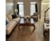 Cozy living room featuring a plush sofa, patterned armchair, and decorative coffee table at 1270 Heritage Lakes Dr, Mableton, GA 30126