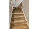 Carpeted staircase leading to the upper level, showcasing the home's multi-story layout and design at 1270 Heritage Lakes Dr, Mableton, GA 30126