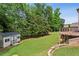 Large backyard with a storage shed and stone retaining wall with plenty of room for outdoor activities at 2785 Old Sewell Rd, Marietta, GA 30068