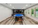 Finished basement with luxury vinyl plank flooring, built-ins and space for recreation at 2785 Old Sewell Rd, Marietta, GA 30068