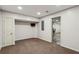 Finished basement area with neutral carpet, recessed lighting, and access to additional space at 2785 Old Sewell Rd, Marietta, GA 30068