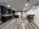 Finished basement featuring a sleek bar area, stylish lighting, and dining table at 2785 Old Sewell Rd, Marietta, GA 30068