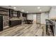 Finished basement featuring bar, stone accent wall, and sliding barn door at 2785 Old Sewell Rd, Marietta, GA 30068