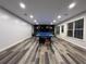 Finished basement with game area, including a ping pong table and modern wood-look flooring at 2785 Old Sewell Rd, Marietta, GA 30068
