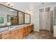 Modern bathroom with double vanities, granite countertops, and large mirrors at 2785 Old Sewell Rd, Marietta, GA 30068