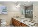 Bathroom featuring a double sink vanity, large mirror, and walk-in shower at 2785 Old Sewell Rd, Marietta, GA 30068