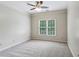 Bright bedroom with neutral walls, carpet, and a large window with natural light at 2785 Old Sewell Rd, Marietta, GA 30068