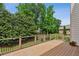Spacious outdoor deck with black metal railing and lush green backyard at 2785 Old Sewell Rd, Marietta, GA 30068