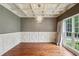 Elegant dining room featuring coffered ceilings, decorative chandelier, and large windows with natural light at 2785 Old Sewell Rd, Marietta, GA 30068