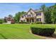 Charming brick home with lush green lawn, beautiful shrubs, and well-maintained landscaping at 2785 Old Sewell Rd, Marietta, GA 30068