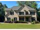 Charming two-story brick home with manicured lawn, black shutters, and inviting front porch at 2785 Old Sewell Rd, Marietta, GA 30068