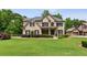 Beautiful brick home with a well-manicured lawn and mature trees providing privacy at 2785 Old Sewell Rd, Marietta, GA 30068