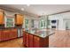 Open kitchen features a granite island, stainless steel appliances, and hardwood floors at 2785 Old Sewell Rd, Marietta, GA 30068