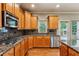 Modern kitchen boasting granite countertops, stainless steel appliances, and custom cabinetry at 2785 Old Sewell Rd, Marietta, GA 30068