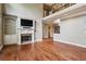 Large living room with fireplace and hardwood floors beneath a second-story mezzanine at 2785 Old Sewell Rd, Marietta, GA 30068