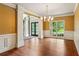Bright living room boasting large windows, decorative columns, and hardwood floors, offering inviting ambiance at 2785 Old Sewell Rd, Marietta, GA 30068