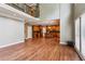 Expansive living space with hardwood floors that connects to the kitchen area beneath a second-story mezzanine at 2785 Old Sewell Rd, Marietta, GA 30068
