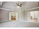 Large main bedroom featuring tray ceilings, neutral walls, and access to the main bath at 2785 Old Sewell Rd, Marietta, GA 30068