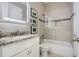 Modern bathroom featuring granite countertops, tiled floors, and shower-tub combination at 2987 Jefferson St, Atlanta, GA 30341
