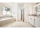 Bright bathroom with a soaking tub, granite counters, and elegant fixtures creating a serene and inviting atmosphere at 2987 Jefferson St, Atlanta, GA 30341