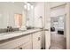 Bathroom with double vanity sinks, granite countertops and a door leading to the bedroom at 2987 Jefferson St, Atlanta, GA 30341